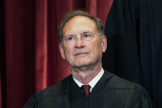 FILE - Associate Justice Samuel Alito sits during a group photo at the Supreme Court in Washington, Friday, April 23, 2021. The Supreme Court has ended constitutional protections for abortion that had been in place nearly 50 years, a decision by its conservative majority to overturn the court's landmark abortion cases. In the final opinion, Alito wrote that the court “cannot allow our decisions to be affected by any extraneous influences such as concern about the public’s reaction to our work.” (Erin Schaff/The New York Times via AP, Pool)