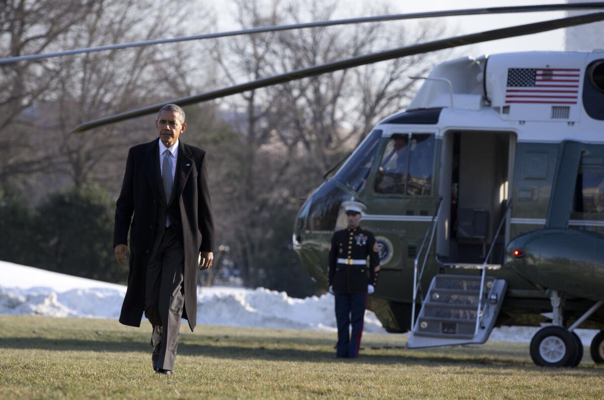 President Obama walks from Marine One as he arrives on the South Lawn of the White House on Jan. 25.