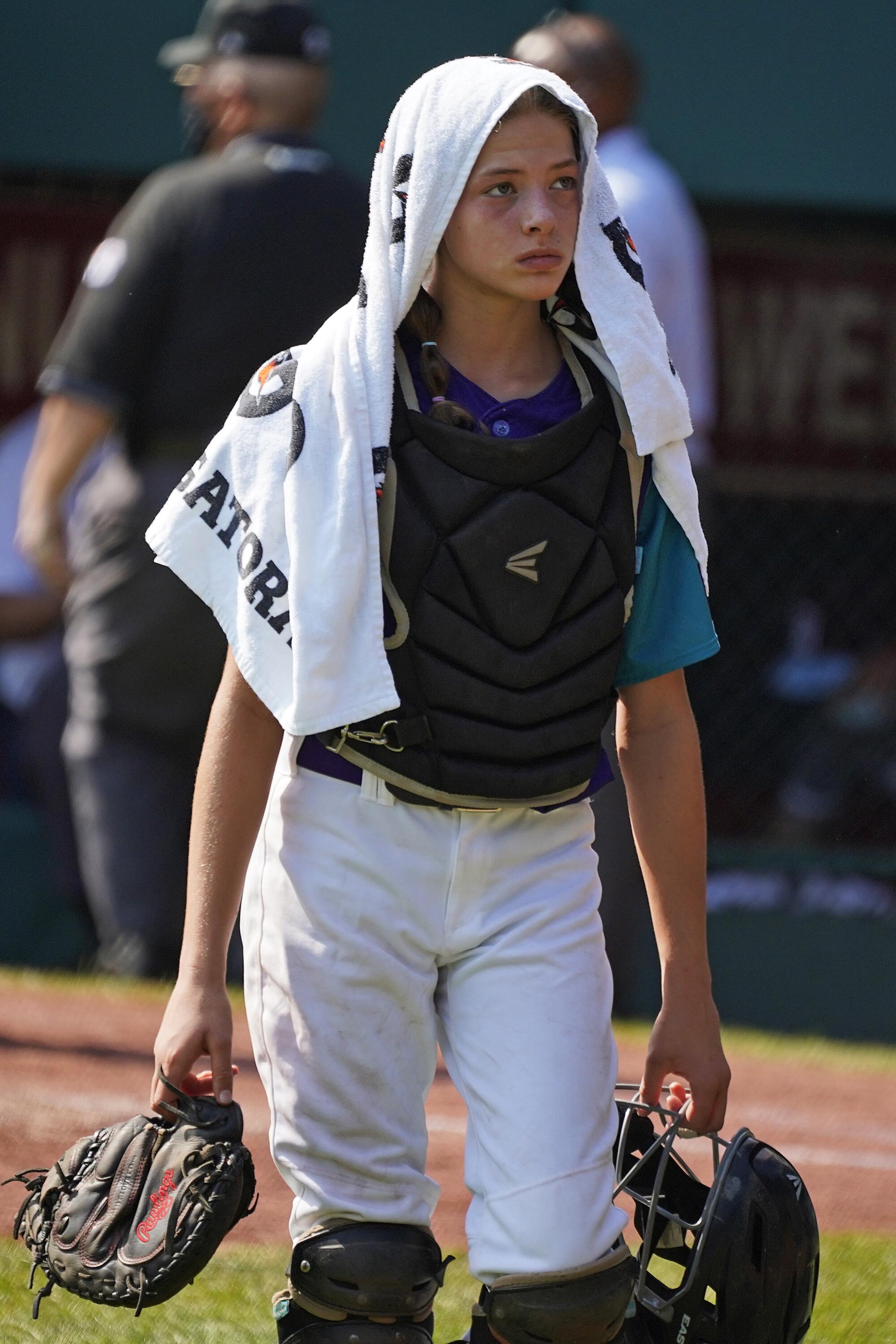 Abilene, Texas catcher Ella Bruning walks to the dugout during a timeout in the second inning