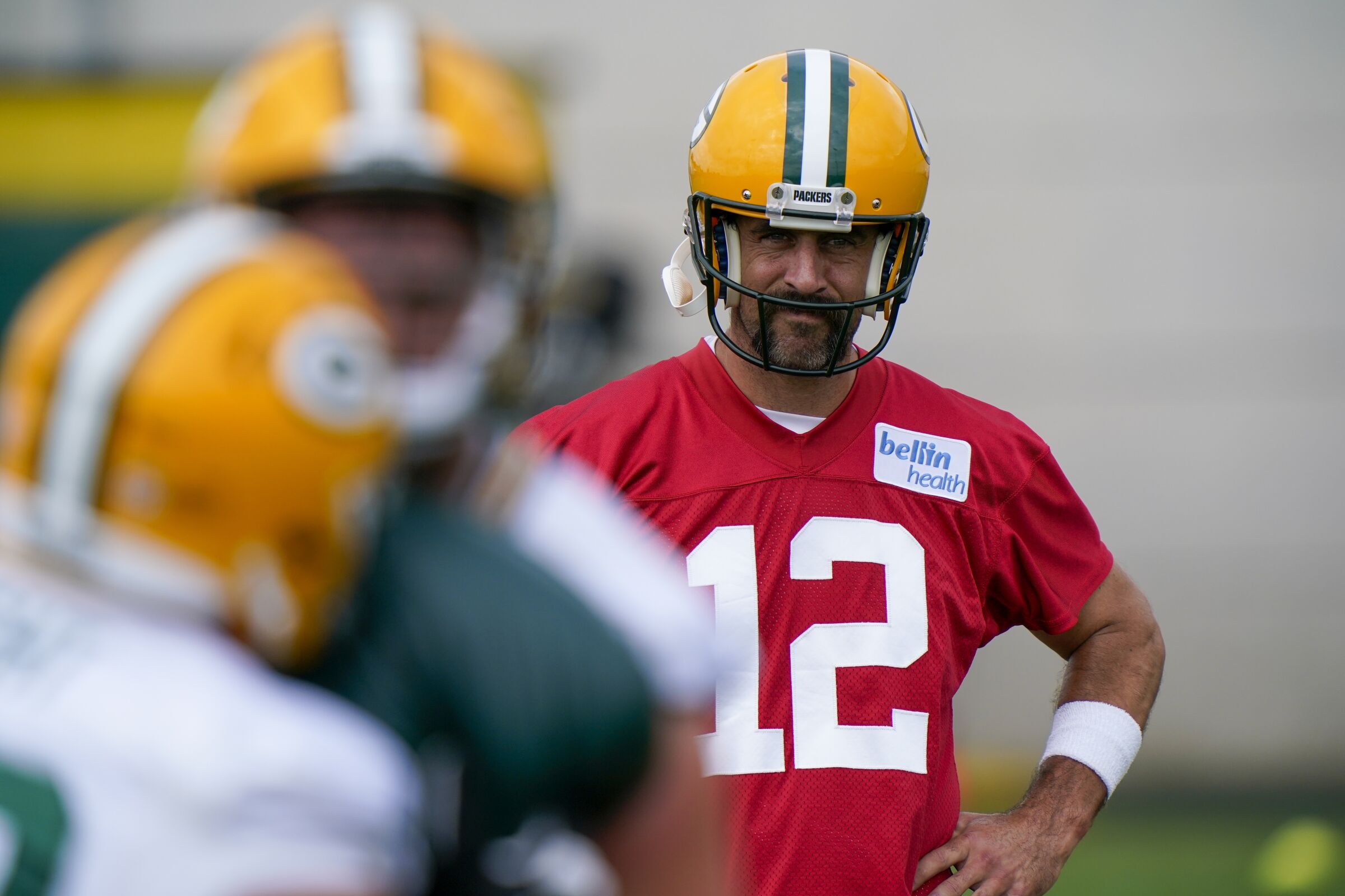 Green Bay Packers' Aaron Rodgers watches during NFL football training camp Saturday, Aug. 15, 2020.