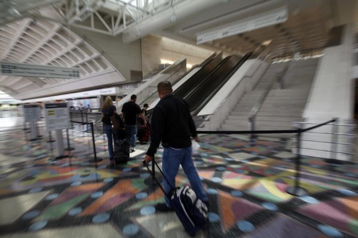 Ecalators lead to security check-in at LA/Ontario International Airport's Terminal 2. Ontario was once the fastest- growing regional airport in the nation. Now it is the among fastest declining.