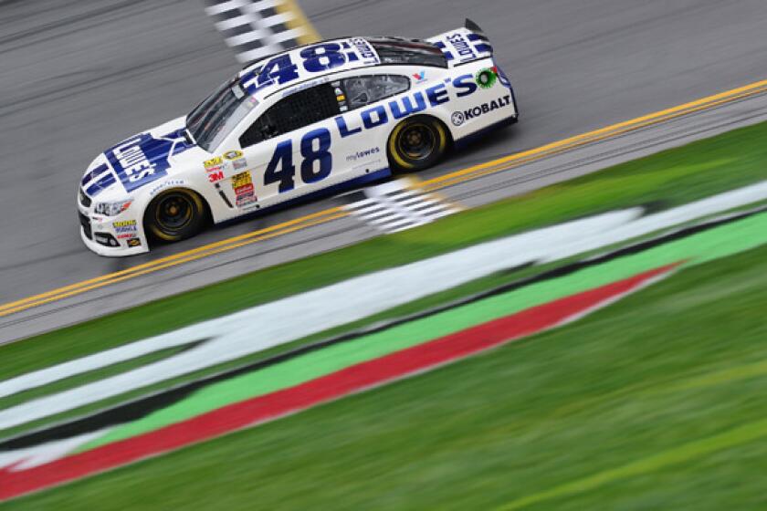 Defending NASCAR Sprint Cup Series champion Jimmie Johnson takes part in a Daytona 500 practice session Saturday. The season-opening contest will be the first run under a new set of rules that will give greater reward to drivers who win races.