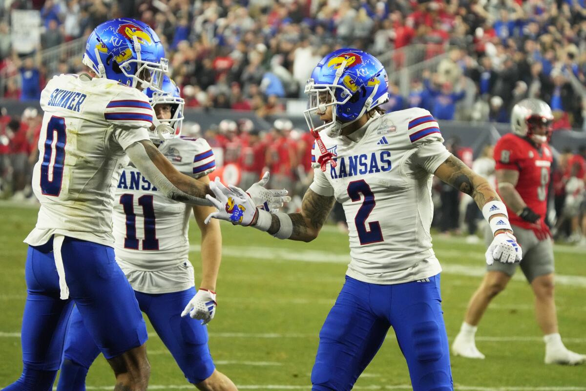 Kansas receiver Lawrence Arnold celebrates after scoring a touchdown against UNLV during the Guaranteed Rate Bowl 