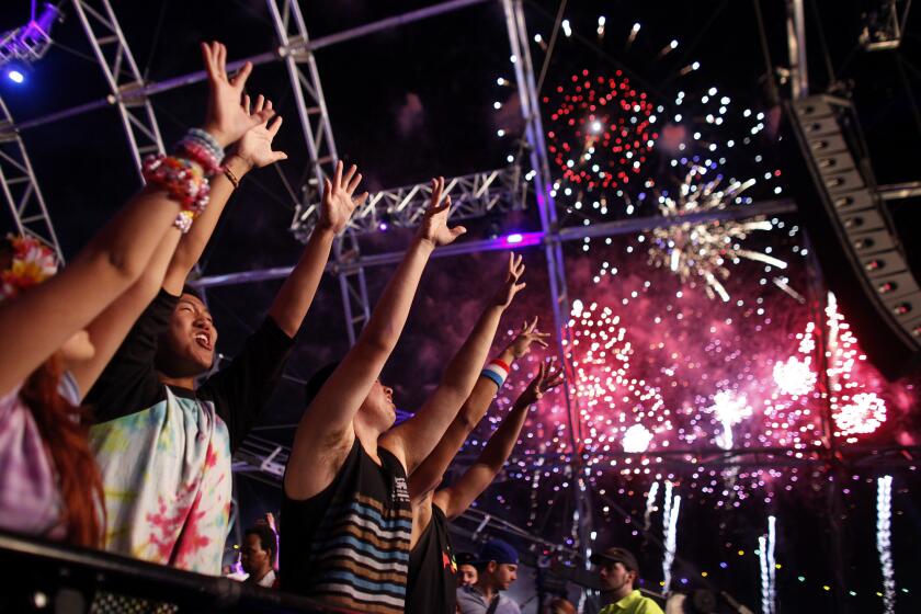 Revelers dance at the Electric Daisy Carnival, presented by Insomniac Events, at the Las Vegas Motor Speedway on June 9, 2012.