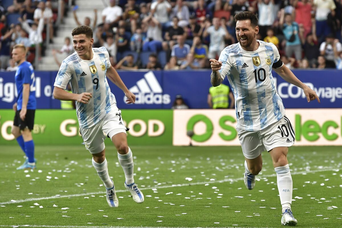 Argentina's Lionel Messi celebrates scoring his side's third goal during friendly match against Estonia at El Sadar stadium in Pamplona, northern Spain, Sunday, June 5, 2022. (AP Photo/Alvaro Barrientos)