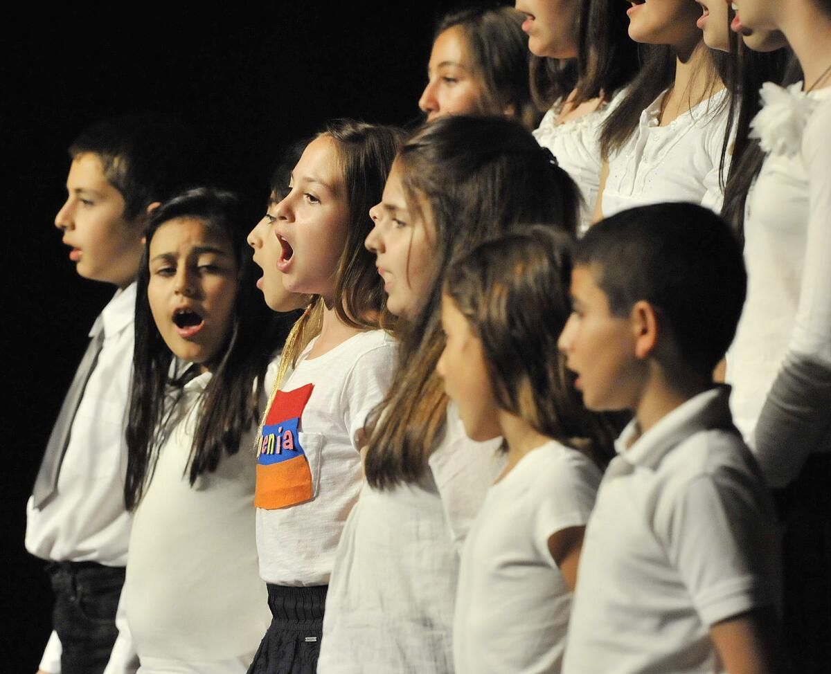 Davidian and Mariamian Elementary School children sign in the 12th Annual Genocide Commemoration at Glendale High School on Monday, April 22, 2013. Glendale high schools and elementary schools performed poems, dance and songs.