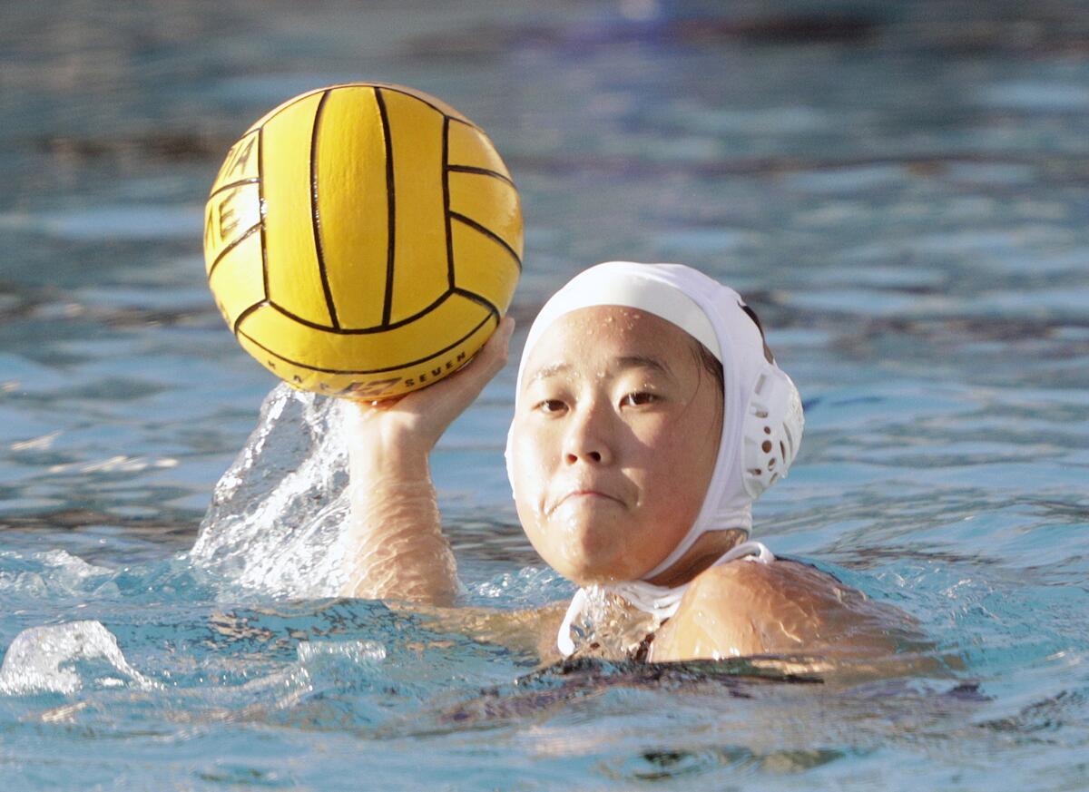 Burbank's Julie Kim looks for a shot against Arcadia in a Pacific League girls' water polo match at Arcadia High School on Thursday, January 9, 2020.