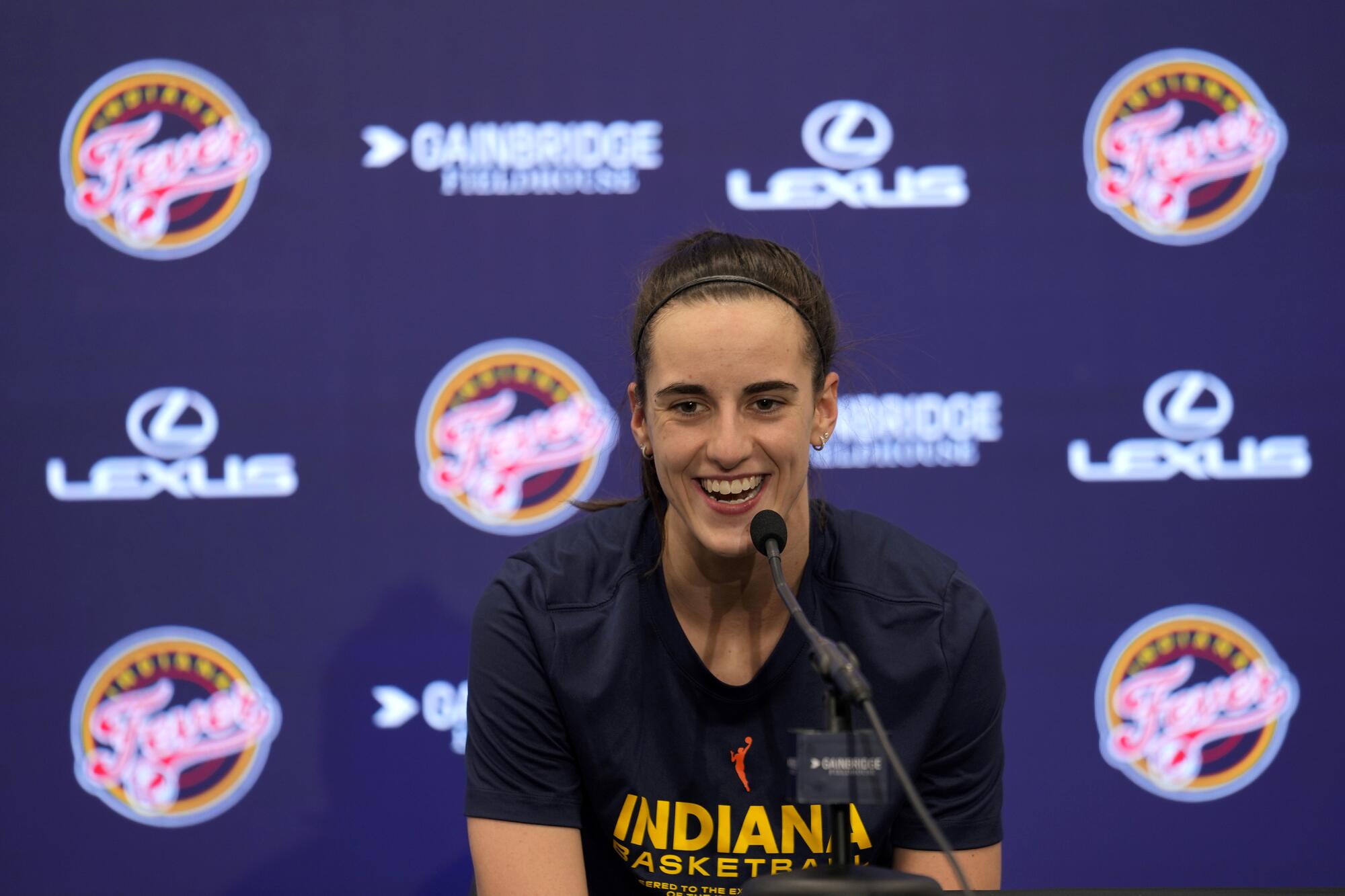 Indiana Fever guard Caitlin Clark speaks during a news conference before a game against the New York Liberty. 