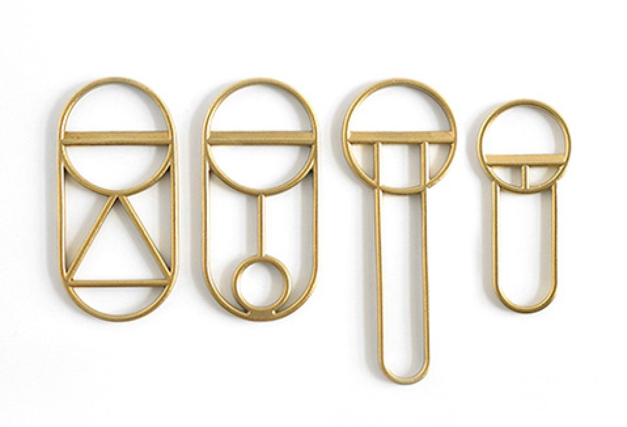 A geometric brass bottle opener.