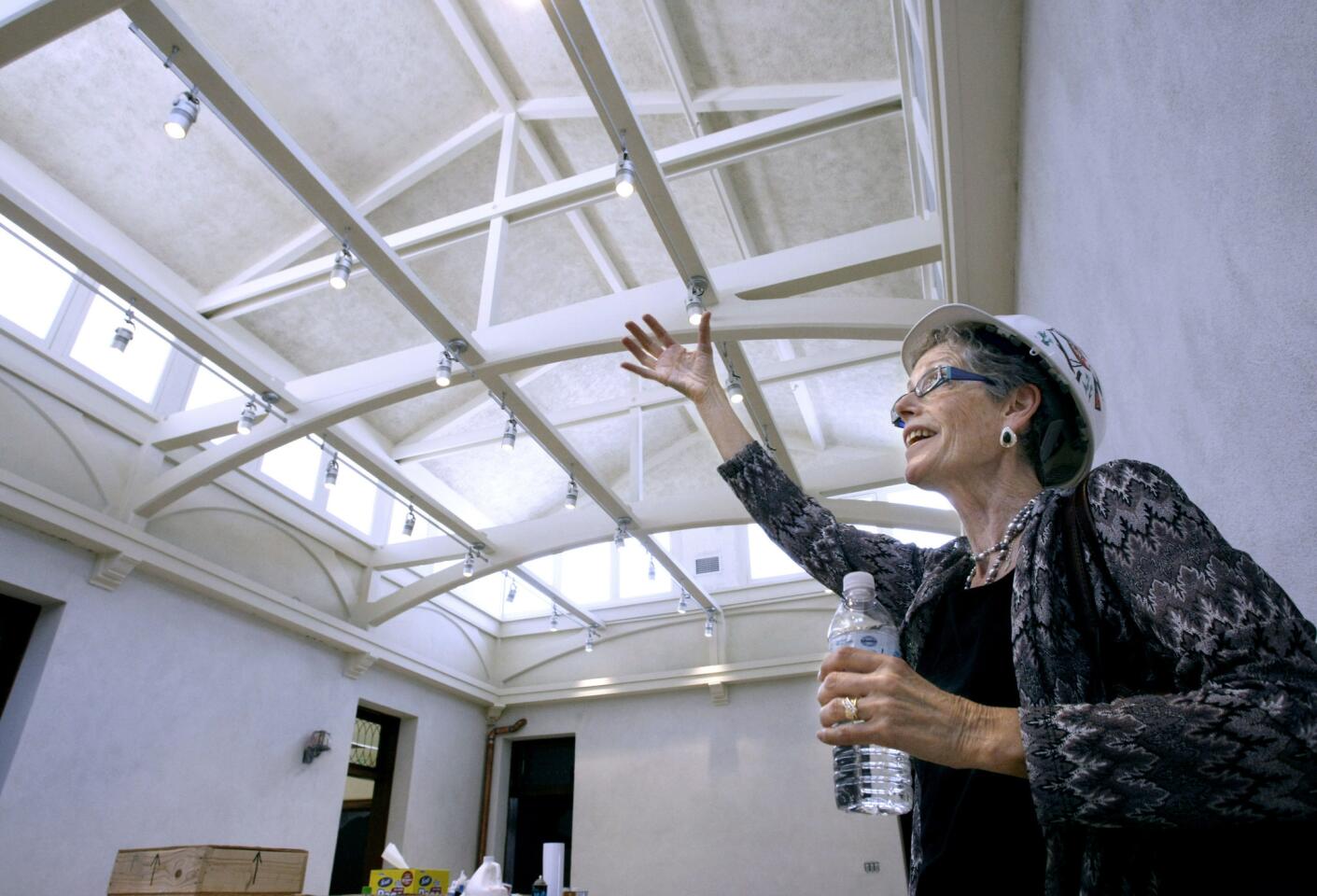 While showing the Solarium room at the Brand Library, City of Glendale Library Administrator Carolyn Flemming talks about the renovations and restoration going on at the landmark library in Glendale on Friday, July 19, 2013. The $9.5 million project began in July 2012 and the library will open in the Spring 2014.