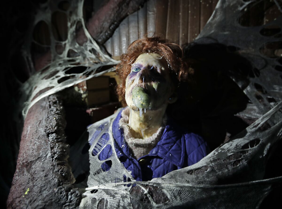 FILE - In this Sept. 12, 2018 file photo, the character Barb appears in grand, gory style in the Stranger Things haunted house during Halloween Horror nights at Universal Studios in Orlando, Fla. After a pandemic-related absence of a year, Halloween Horror Nights are back with haunted houses based on the “Texas Chainsaw Massacre” and “The Bride of Frankenstein" planned for Universal theme parks in California and Florida, the company announced Thursday, July 15, 2021. (AP Photo/John Raoux, File)