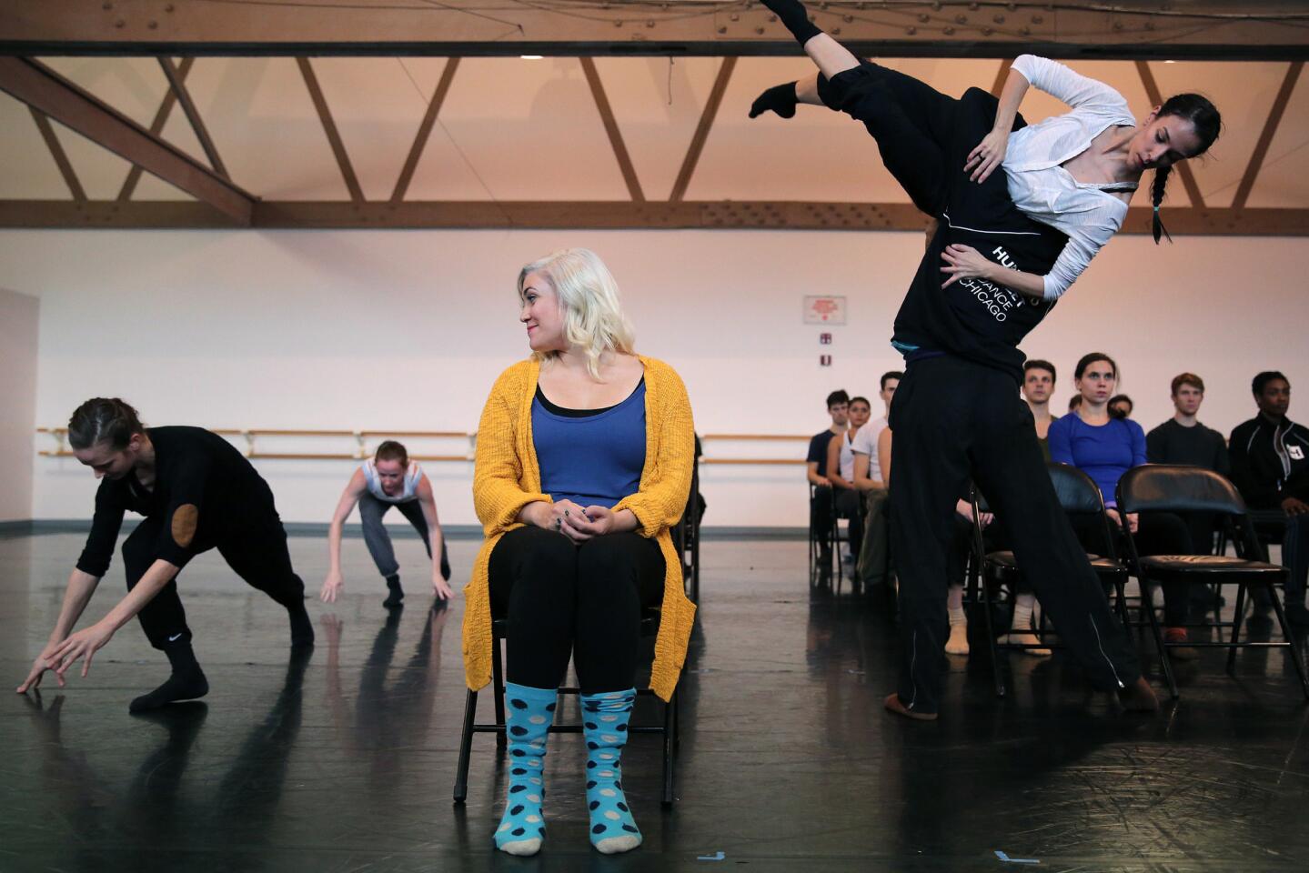 Ensemble member Carisa Barreca, center, watches Hubbard Street dancers perform during a rehearsal for "The Art of Falling," a collaboration between Chicago's Hubbard Street and The Second City, Oct. 29 at the Hubbard Street Studios in Chicago.