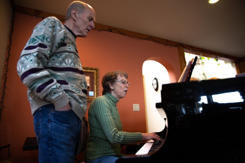 Mark Backlund, 73, and his wife, Ruth Backlund, 72, recover from the coronavirus (COVID-19) at their home in Anacortes, Washington on March 27, 2020. Both of them are singers in the Skagit Valley Chorale that experienced a huge uptick in members getting the coronavirus after a rehearsal at a church in Mount Vernon, Washinton on March 10. 27 tested positive for COVID-19. Two have died. The outbreak in a rural community shows how contagious coronavirus is, and how quickly it can spread. (Karen Ducey/For The Times)