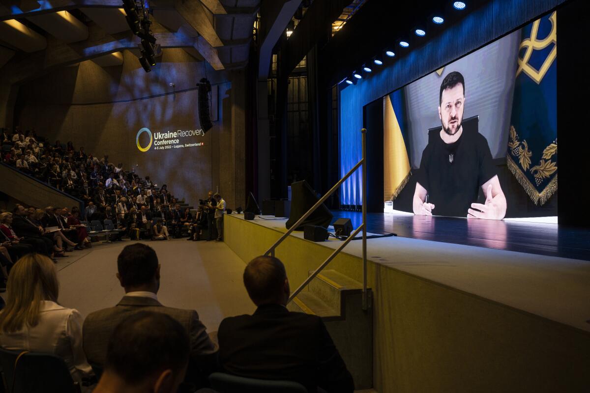 Ukrainian President Volodymyr Zelenskyy, delivers a speech by video conference during the Ukraine Recovery Conference URC, Monday, July 4, 2022 in Lugano, Switzerland. The URC is organised to initiate the political process for the recovery of Ukraine after the attack of Russia to its territory. (Alessandro della Valle/Keystone via AP)