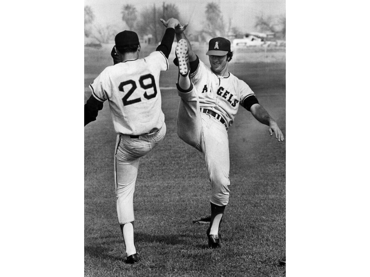 Feb. 27, 1973: Angels pitchers Sid Monge, left, and Clyde Wright use a high stepping exercise during spring training in Holtville, Calif.