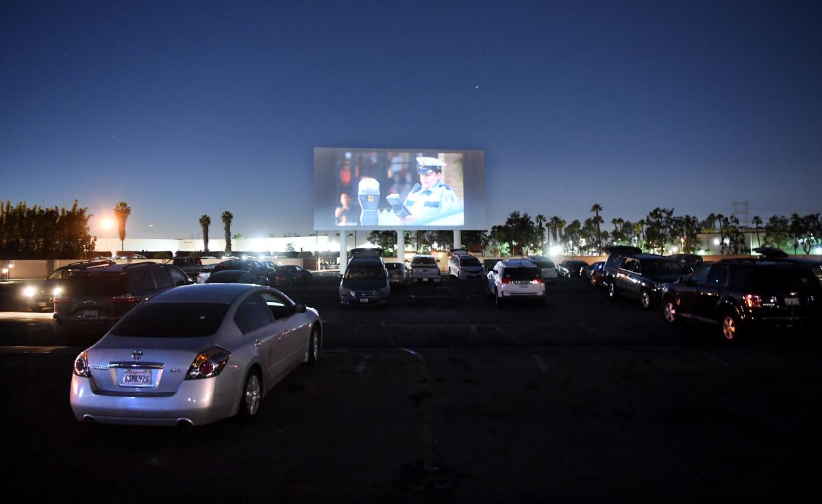 PARAMOUNT, CALIFORNIA MARCH 17, 2020-Cars gather before a movie at the Paramount Drive-In. (Wally Skalij/Los Angeles Times)