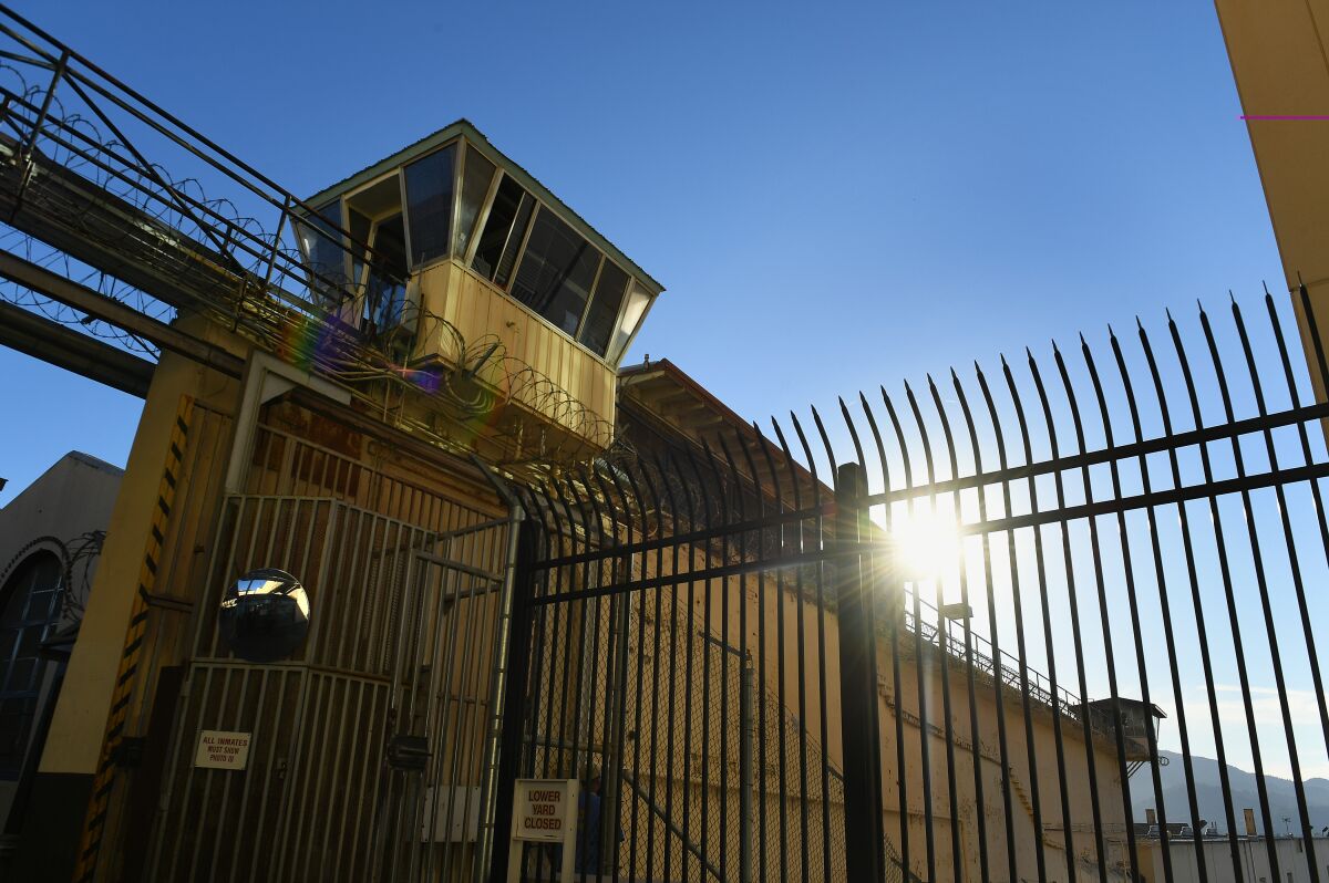 Sunlight peers through the bars at San Quentin State Prison