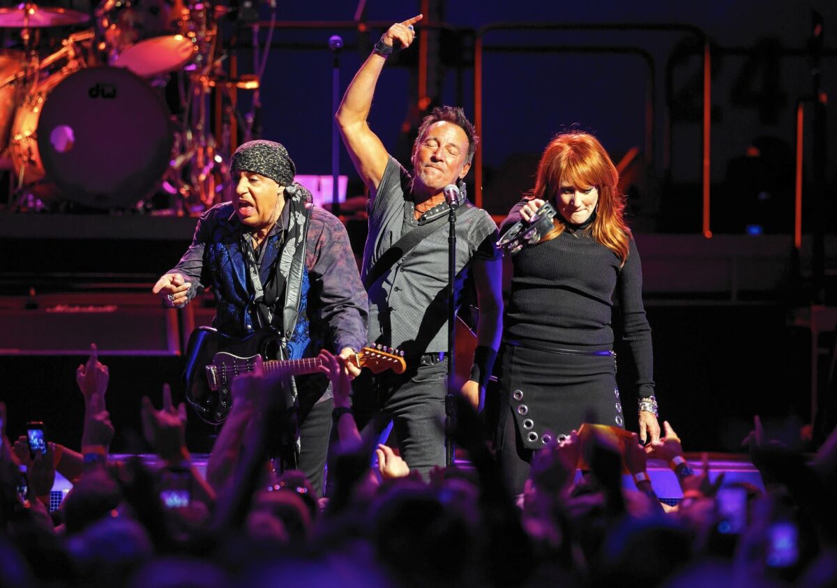 Steven Van Zandt, left, Bruce Springsteen and Patti Scialfa perform at the Los Angeles Sports Arena on March 19, 2016, the last concert at the half-century-old venue in Exposition Park before it's razed to make room for a soccer stadium.