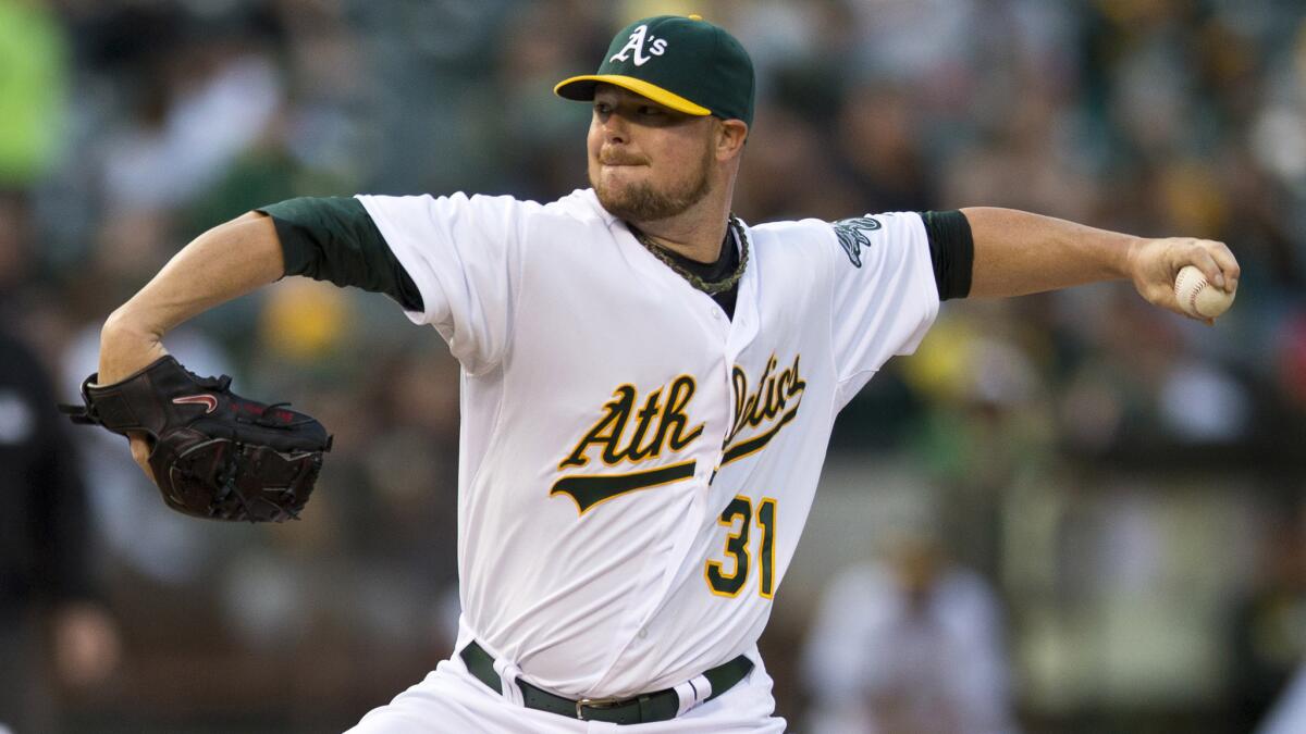 Oakland Athletics starter Jon Lester delivers a pitch during a game against the Philadelphia Phillies in September. Don't expect to see Lester in a Dodgers uniform next season.