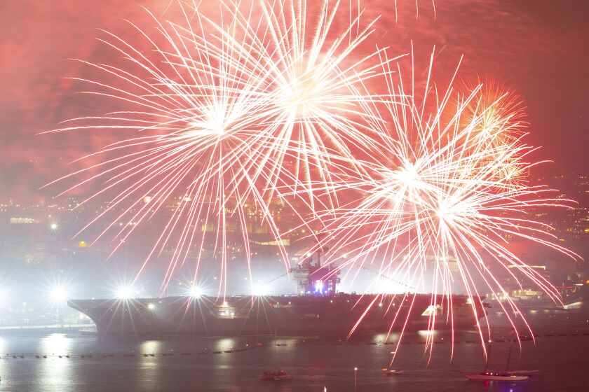 SAN DIEGO, CA - JULY 4: Fireworks fill the sky near the USS Theo