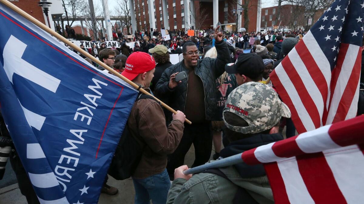 Daryle Jenkins, center, argues with President Trump supporters at a Rutgers University protest last month.