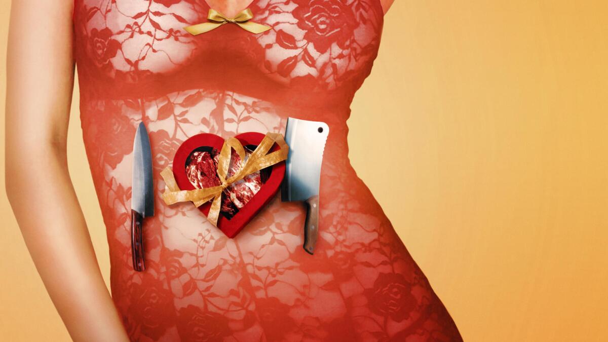 Knives and a heart-shaped chocolate box in front of a woman.