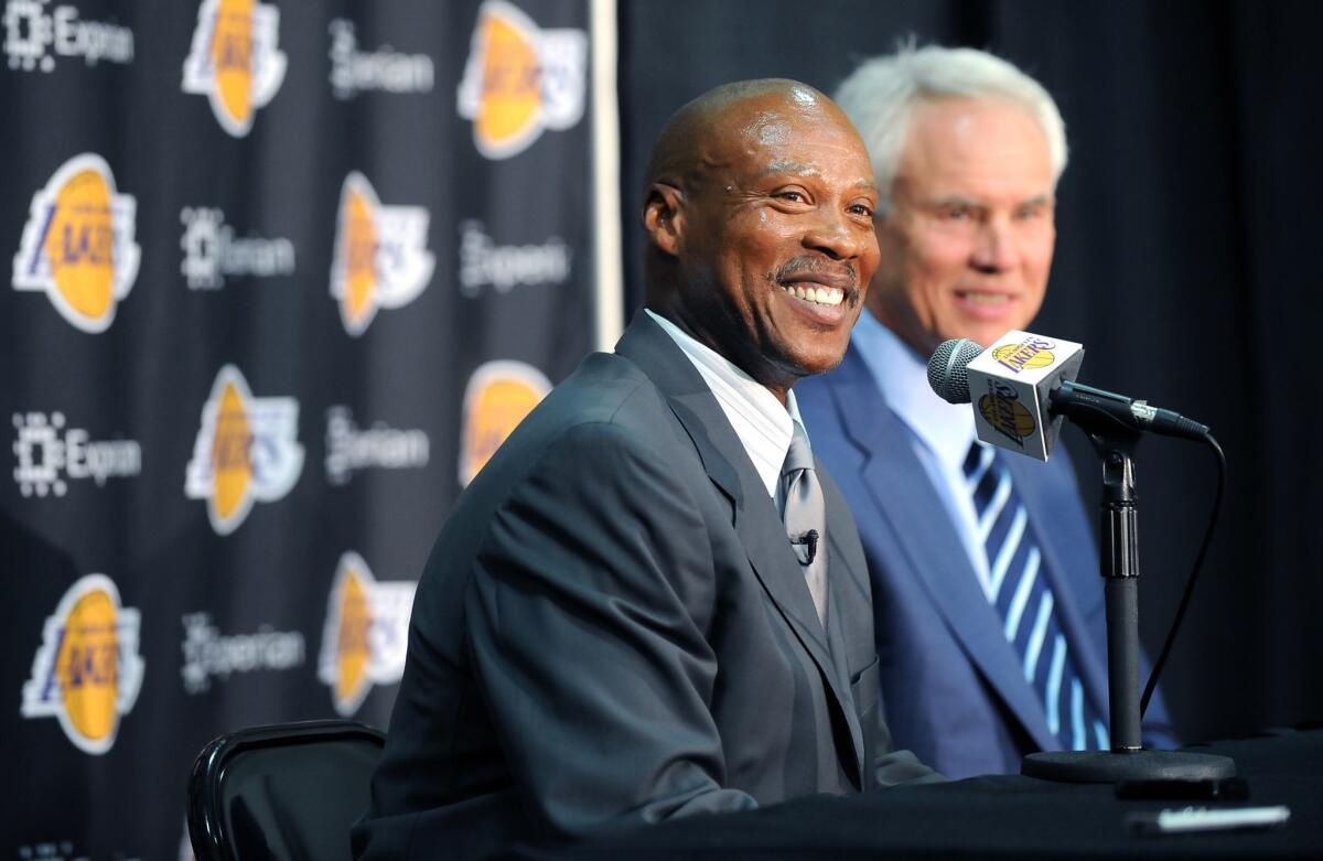 New Lakers Coach Byron Scott, left, smiles while sitting next to General Manager Mitch Kupchak during a July 29 news conference in El Segundo.