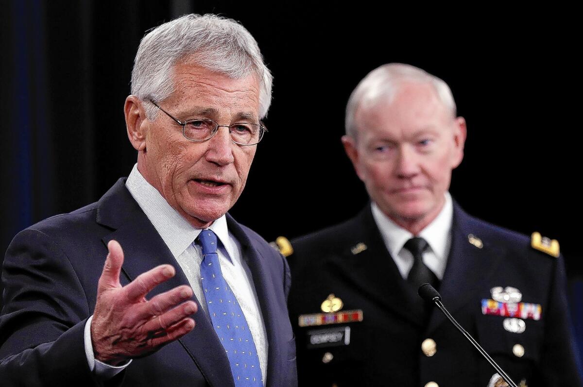 Defense Secretary Chuck Hagel, left, and Joint Chiefs of Staff Chairman Gen. Martin Dempsey address proposed budget cuts to the Pentagon.