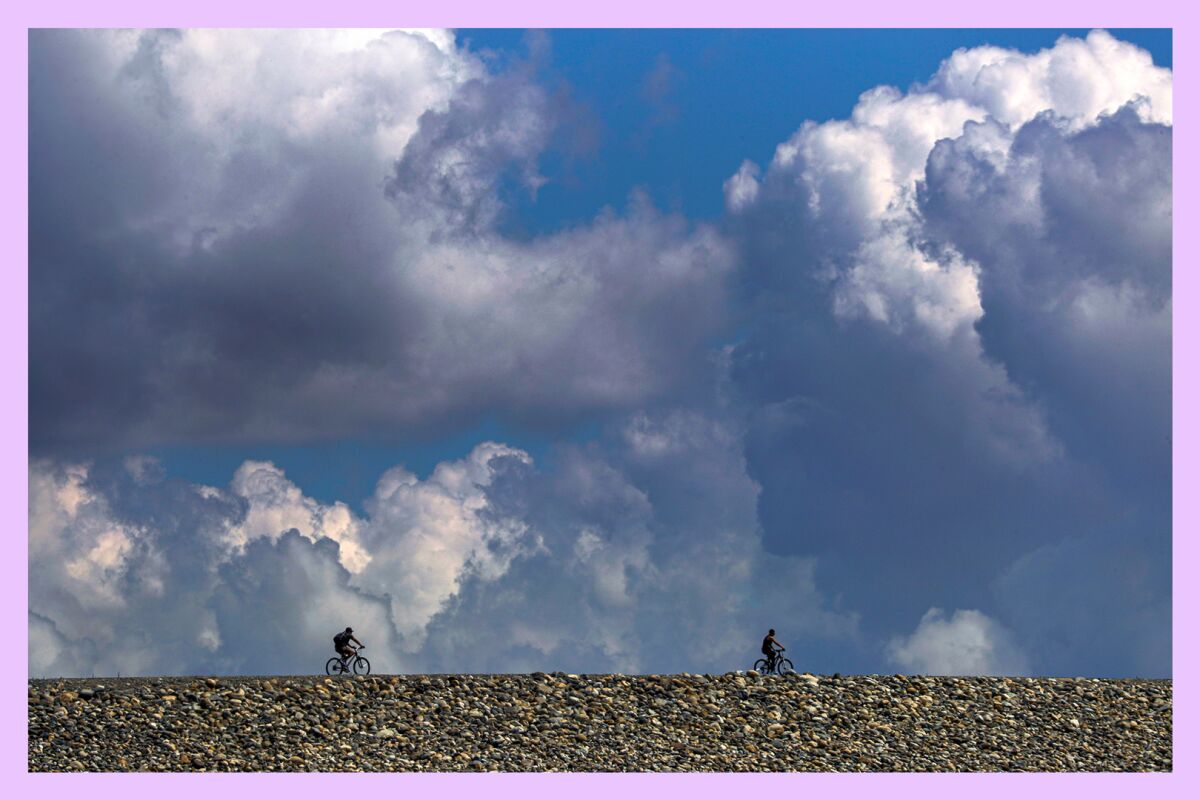 Two cyclists riding their bikes on Santa Fe Dam