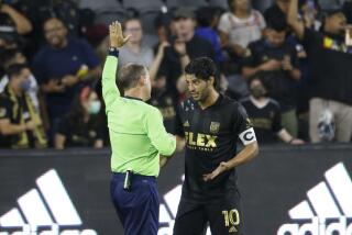 Los Angeles FC forward Carlos Vela (10) argues with a referee during an MLS soccer match between the Los Angeles FC and the Vancouver Whitecaps in Los Angeles, Saturday, July 24, 2021. (AP Photo/Ringo H.W. Chiu)