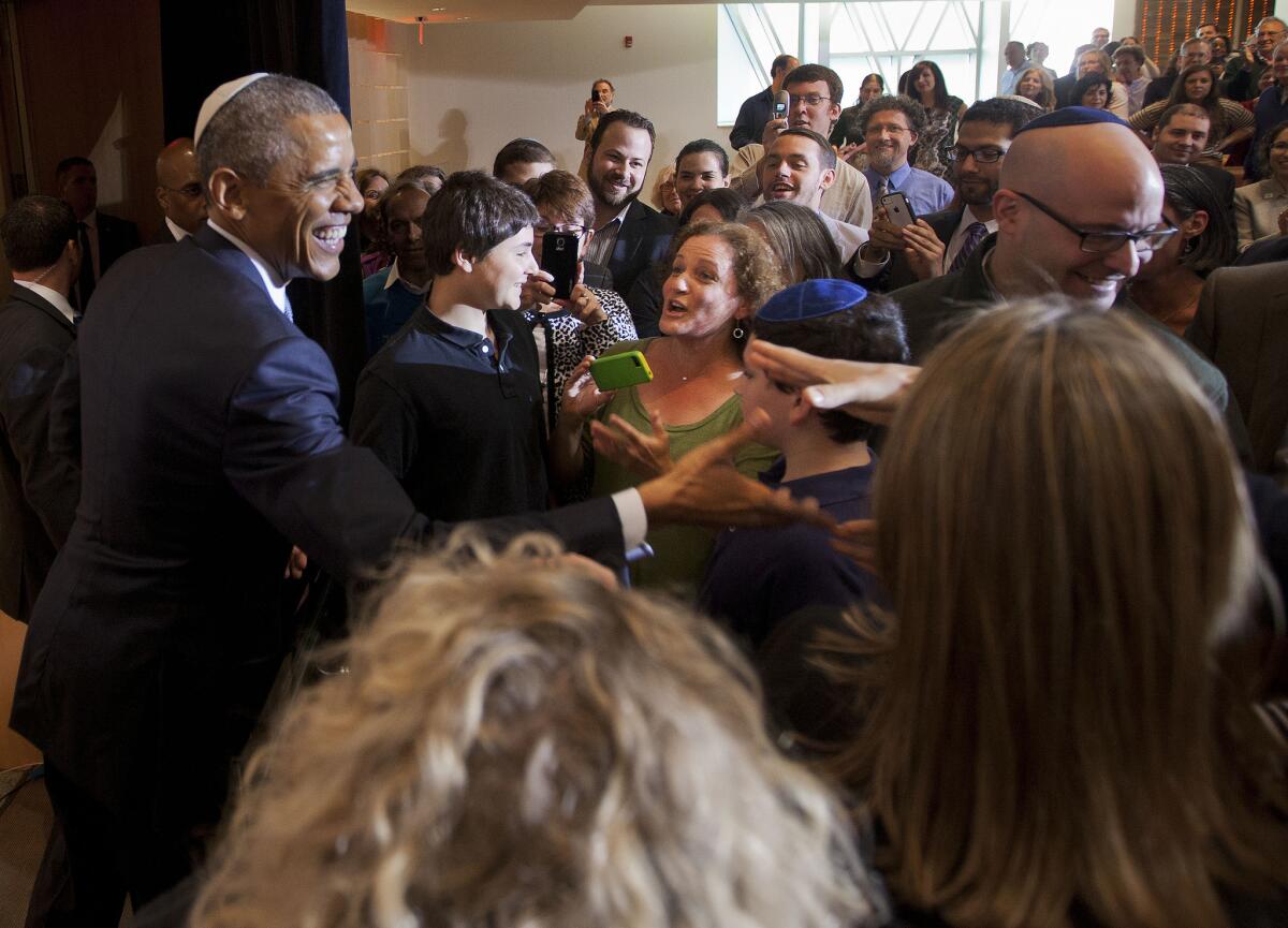 President Obama greets people after speaking at Adas Israel Congregation in Washington, Friday, May 22, 2015.
