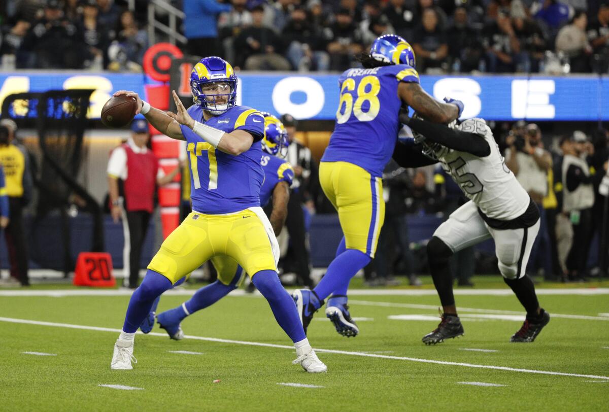 Rams quarterback Baker Mayfield looks to pass in the second quarter. 