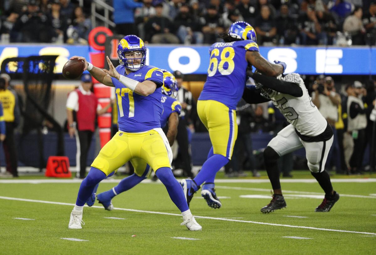 Rams quarterback Baker Mayfield looks to pass in the second quarter.