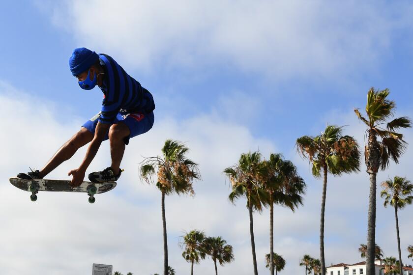 VENICE BEACH, CALIFORNIA JUNE 30, 2020-Isiah Hilt gets air while doing tricks in Venice Beach Tuesday. L.A. County beaches will be closed for the July 4th weekend due to the resurgence of the coronavirus. (Wally Skalij/Los Angeles Times)