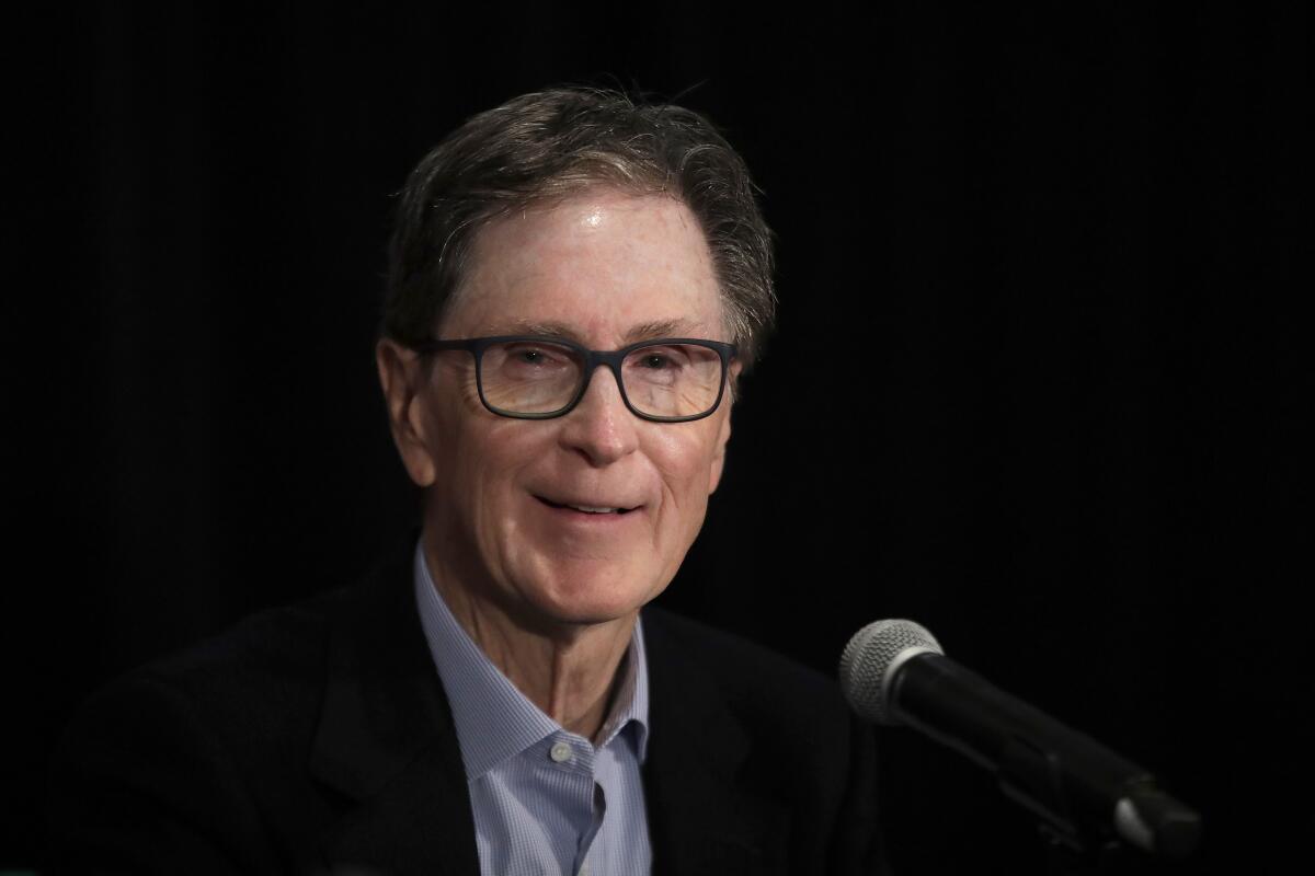 Boston Red Sox principal owner John Henry speaks at a news conference.