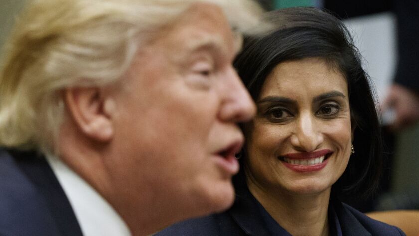 Centers for Medicare and Medicaid Services Administrator Seema Verma, who is overseeing approval of work requirement for the program, listens admiringly to President Trump during a White House meeting in 2017.