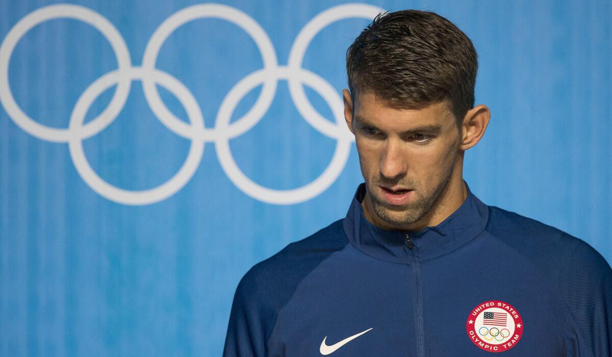 Michael Phelps arrives to a news conference at the Olympic Park in Rio de Janeiro on Wednesday.