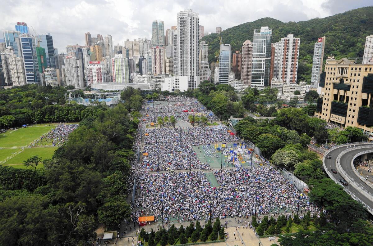Thousands march through downtown Hong Kong on July 1 in an annual pro-democracy protest.