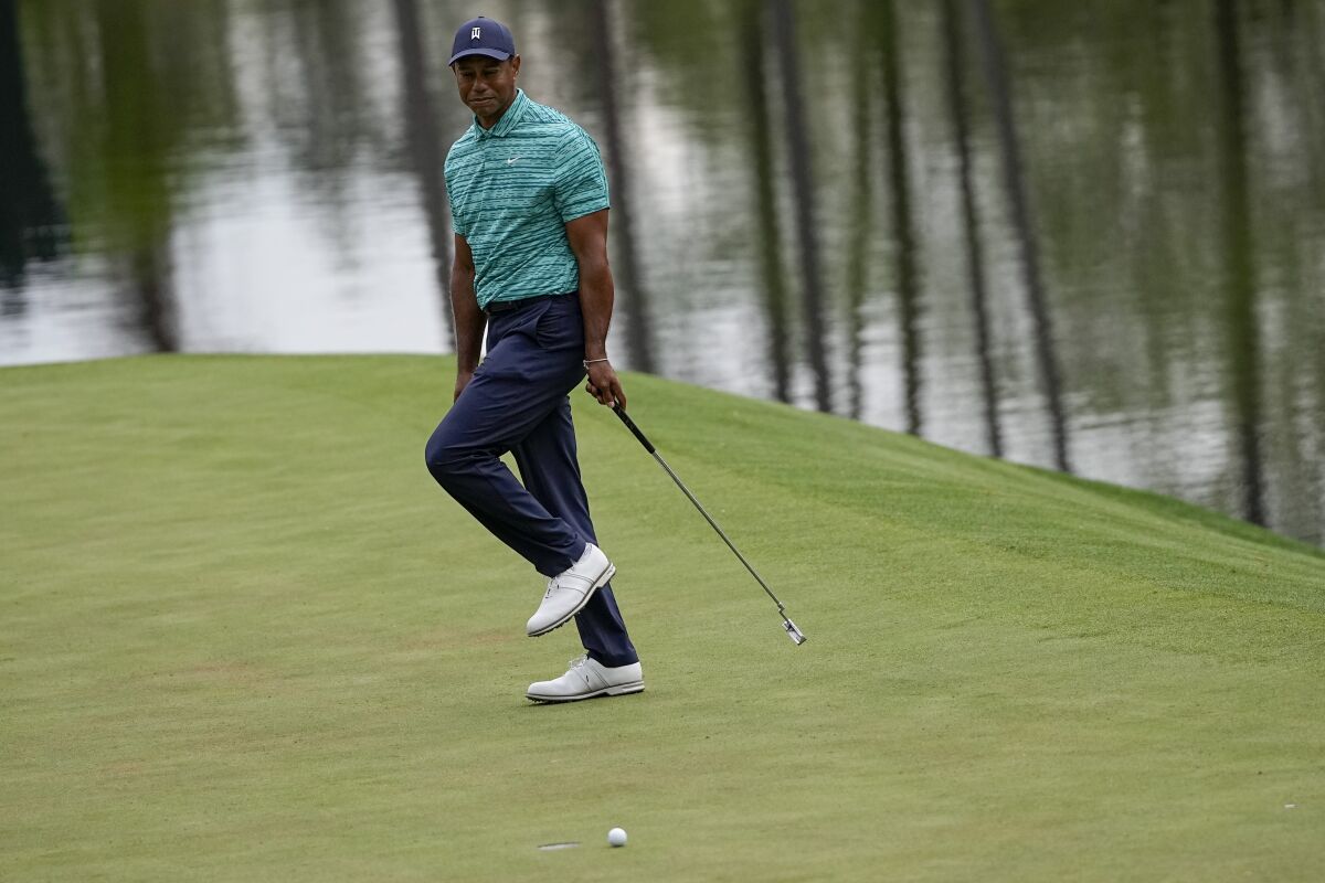 Tiger Woods reacts after missing birdie putt on the 16th hole.