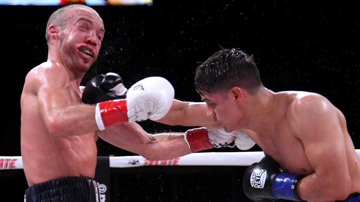 TJ Doheny (left) and Daniel Roman (right) exchange punches at The Forum on April 26, 2019.