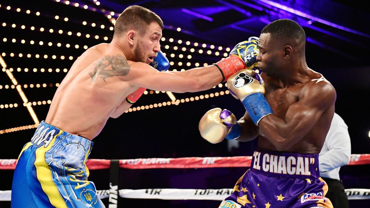 Vasiliy Lomachenko lands a punch against Guillermo Rigondeaux during their super-featherweight title fight Saturday at Madison Square Garden.