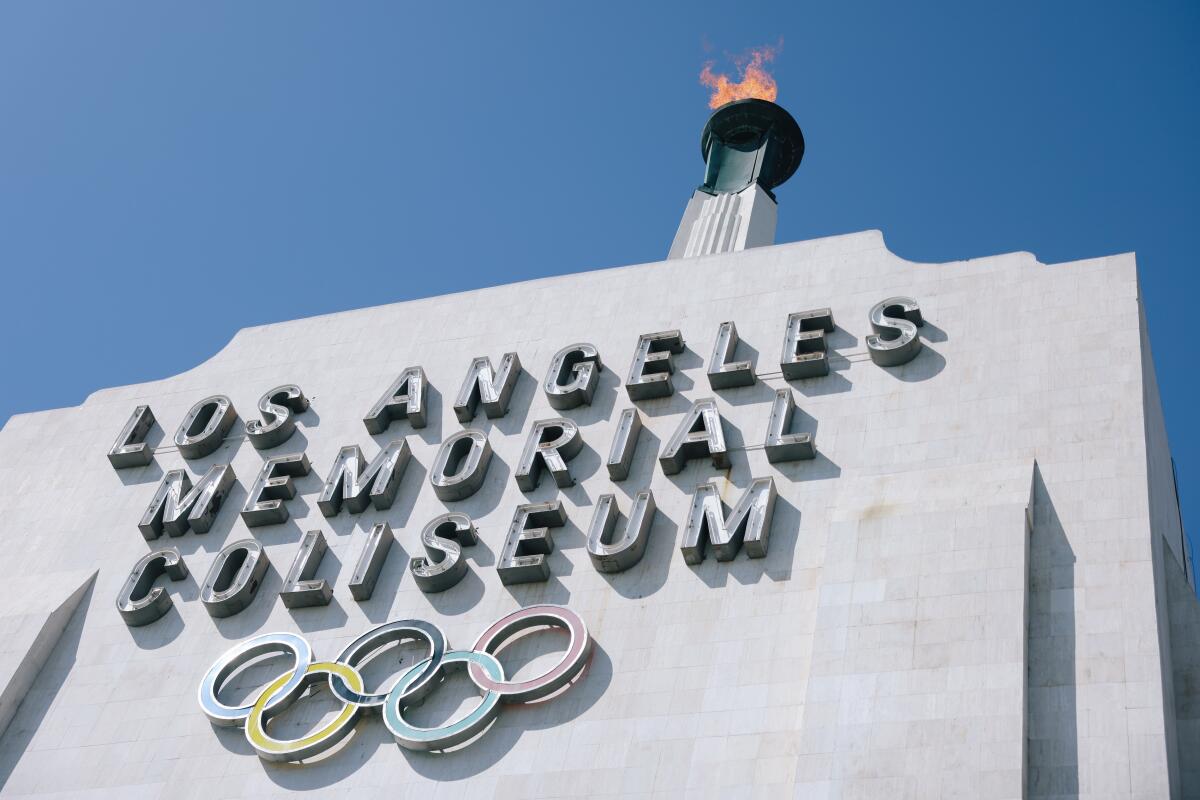 The torch is lit at the Los Angeles Memorial Coliseum.