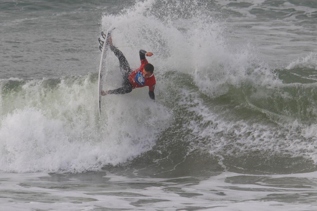 Levi Slawson surfs in a semifinal heat of the SLO CAL Open at Pismo Beach Pro Junior.