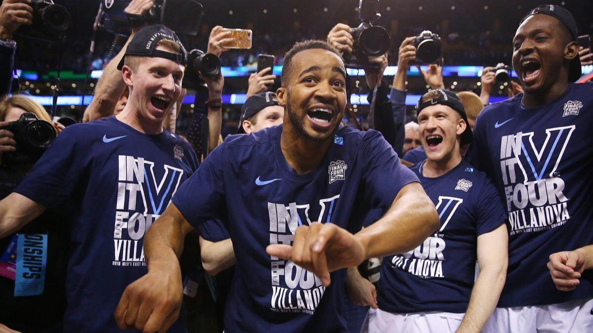 Villanova's Phil Booth celebrates with teammates after defeating Texas Tech in the NCAA tournament East Regional to advance to the Final Four.