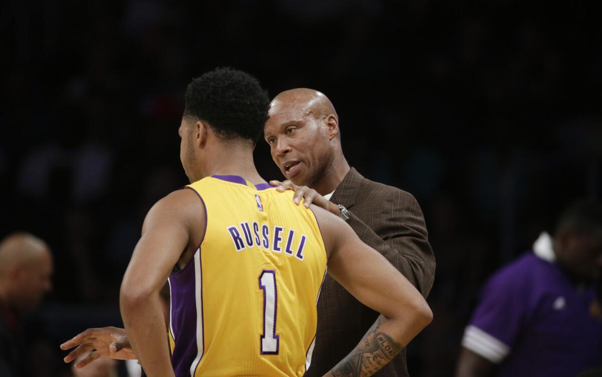 Lakers Coach Byron Scott talks to guard D'Angelo Russell during the first half of a preseason game on Oct. 11.