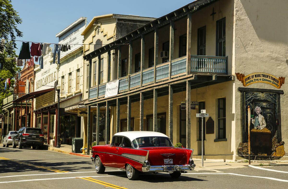 A vintage Chevrolet cruises down Main Street in Angels Camp, Calif., past the former Angels Hotel building where Mark Twain first heard the story about the famous jumping frog.