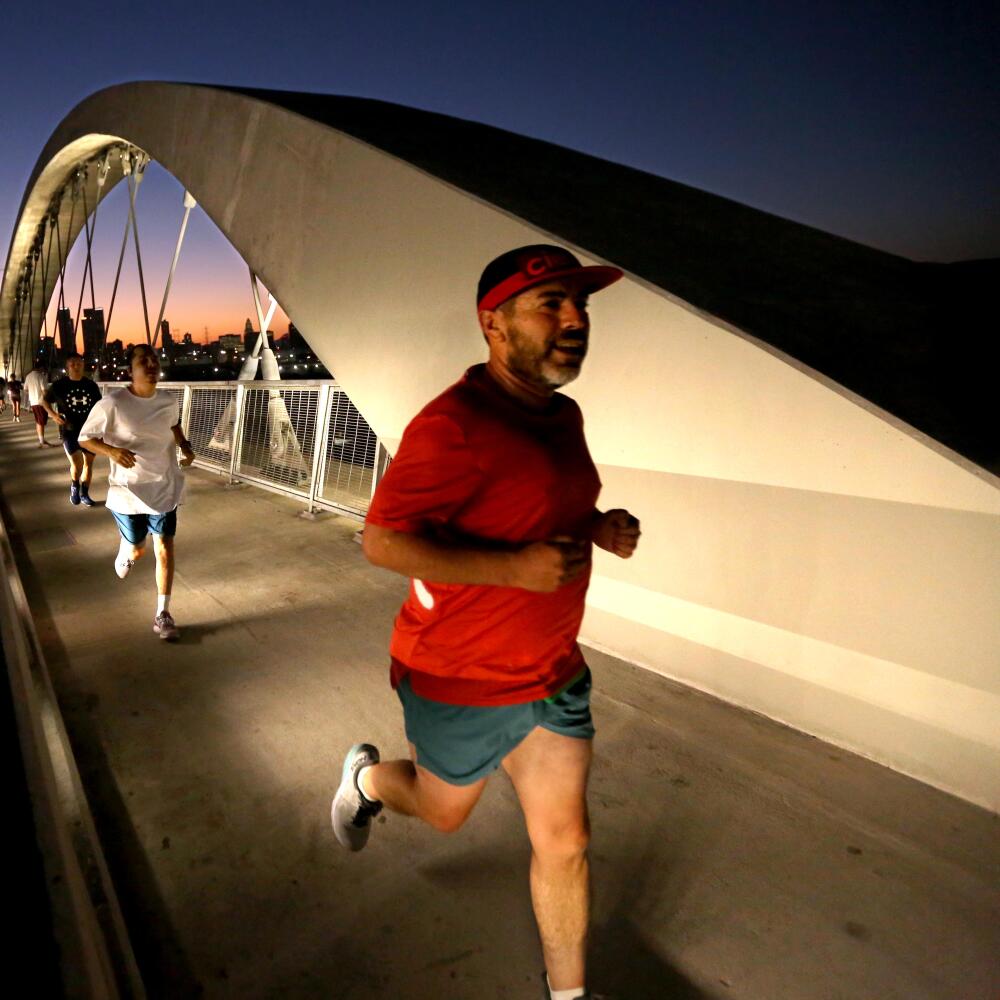 A man running on a bridge