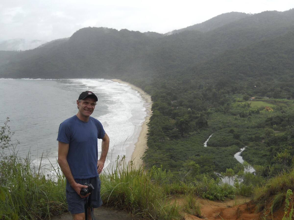 In this photo provided by Tom Hennigan, British Journalist Dom Phillips poses for a photo during a hike in Paraty, Brazil, April 2, 2010. British journalist Dom Phillips’ quest to unlock the secrets of how to preserve Brazil’s Amazon was cut short this June 2022, when he was killed along with a colleague in the heart of the forest he so cherished. (Tom Hennigan via AP)