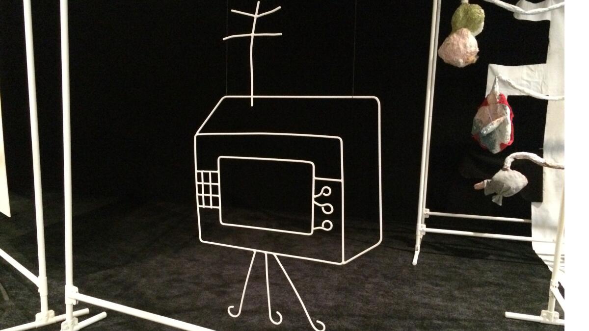 Much of Bock's environment is geometric in nature — "drawn" with wire or tubing to evoke walls or furnishings, such as this TV set.