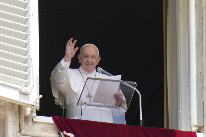 Pope Francis waves to the crowd as he arrives to recite the Angelus noon prayer from the window of his studio overlooking St.Peter's Square, at the Vatican, Sunday, July 4, 2021. (AP Photo/Alessandra Tarantino)